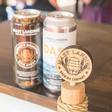 A picture of two cans on a table at Maine Brew Fest at Sunday River