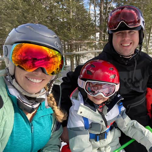 Family on chairlift smiling