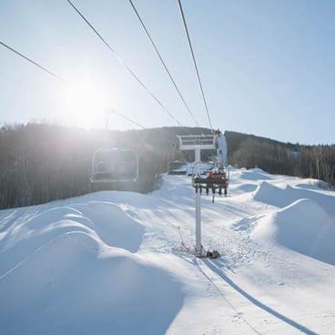 sun and snowmaking at Sunday River