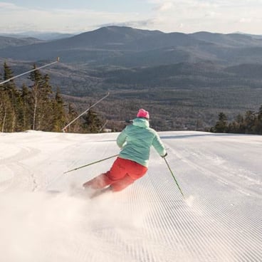 A skier getting first tracks on American Express. 