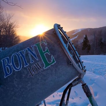 Snowmaking gun over the sunrise at Sunday River