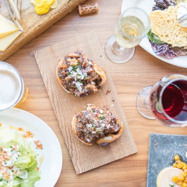 Lunch spread with snacks and wine