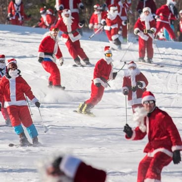 Santas skiing and snowboarding at Sunday River. 