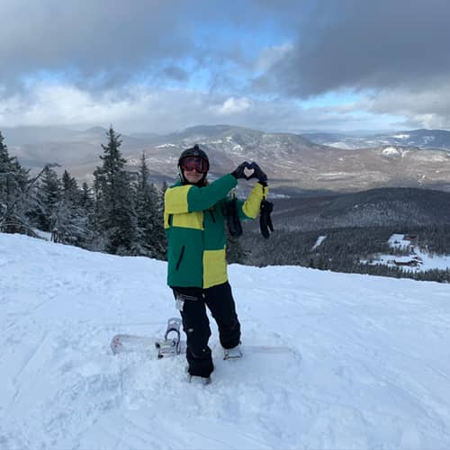 kid smiling on hill