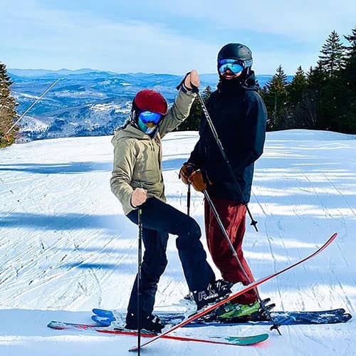 Skiers with mountain views.