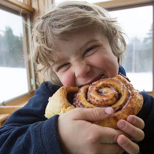 Eating cinnamon bun at North Peak.