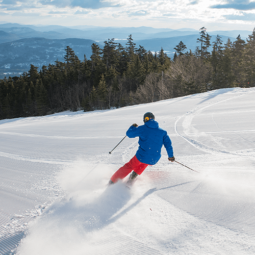 Person carving turn on corduroy