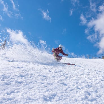 spring skiing blue sky white heat trail