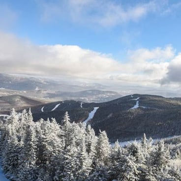 scenic view of mountain range in winter